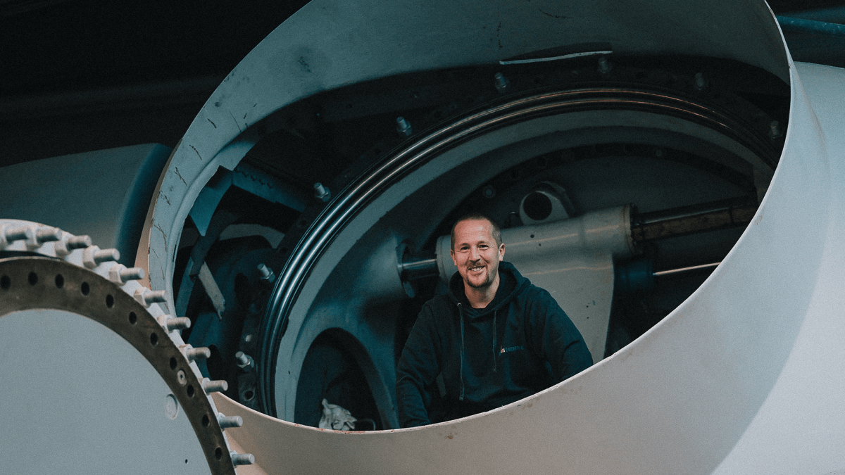 A colleague in at our ENERTRAG Service headquarter in Lübeck, peaking out of an old wind turbine